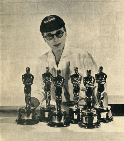 Head poses with 6 of her Academy Awards statues.