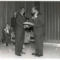 Photograph of Hartford Smith Jr. receiving an award at Wayne State University