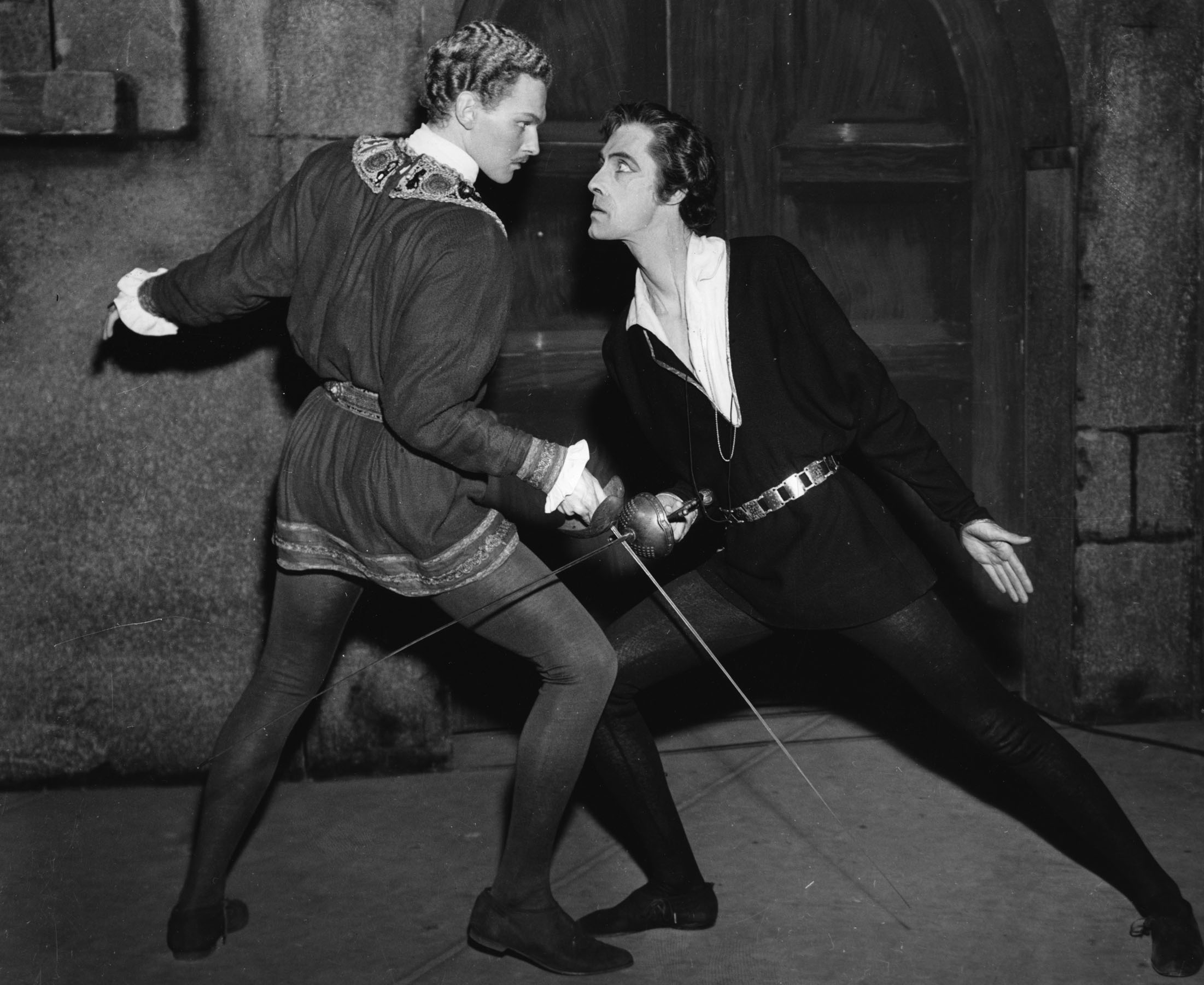 Original caption reads, "Robert Duke as Laertes (left) and John Carradine as Hamlet (right) in a production of Shakespeare’s play, circa 1943."